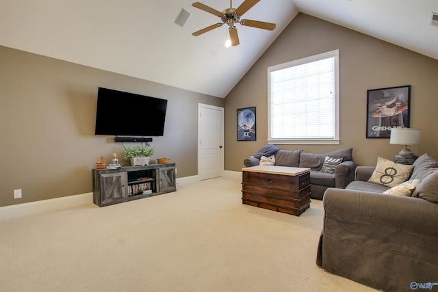 carpeted living room with ceiling fan and vaulted ceiling