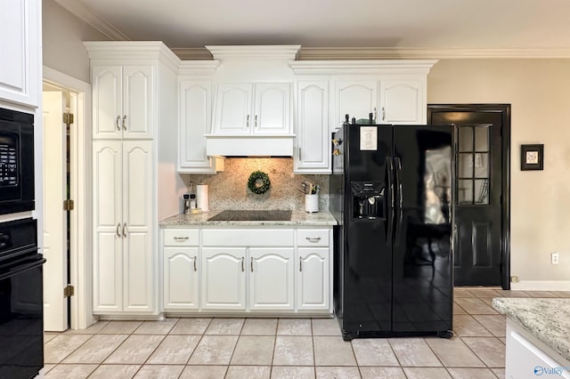 kitchen with white cabinetry, light stone counters, tasteful backsplash, and black appliances