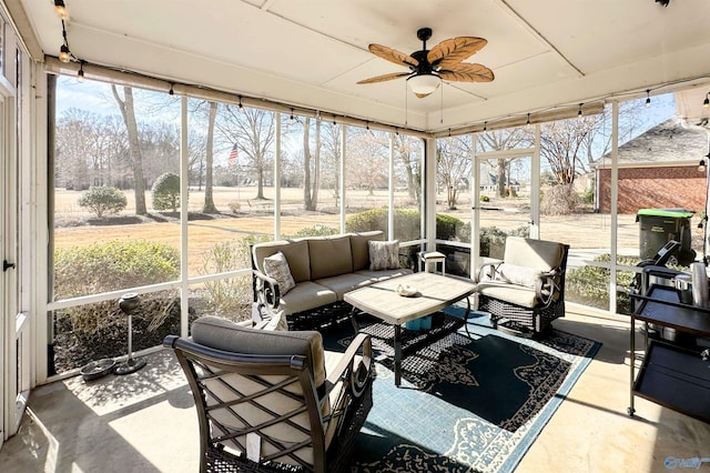 sunroom featuring a wealth of natural light and ceiling fan