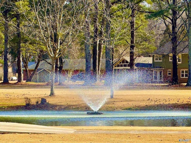 surrounding community featuring a water view