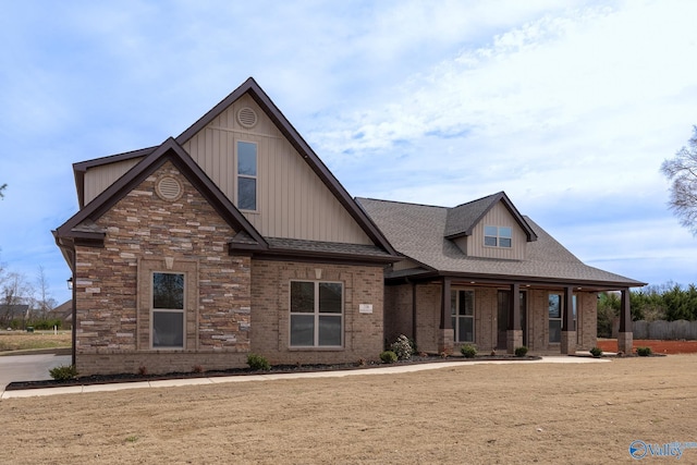 craftsman house with brick siding and roof with shingles