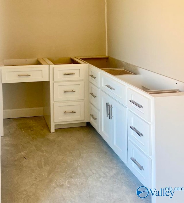 bathroom with concrete flooring