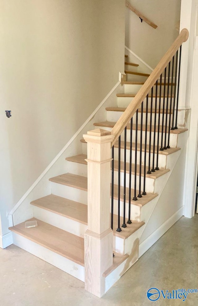 stairs with concrete floors