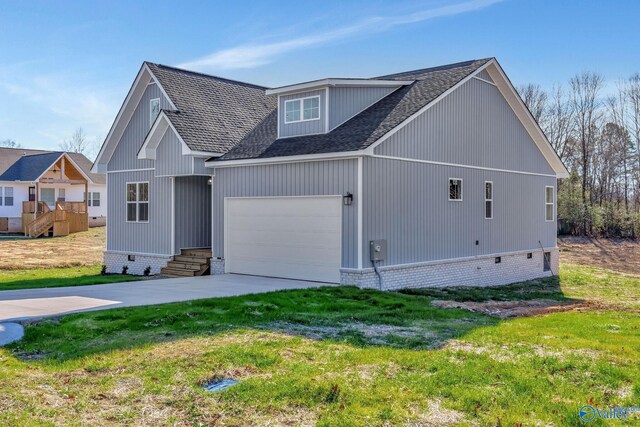 view of front of property with a garage and a front yard