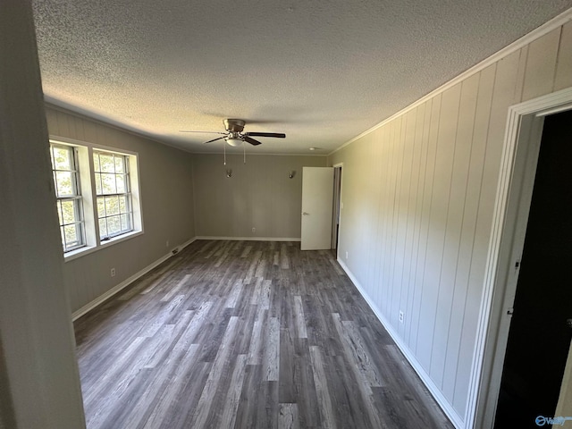 empty room with ceiling fan, a textured ceiling, ornamental molding, and hardwood / wood-style flooring