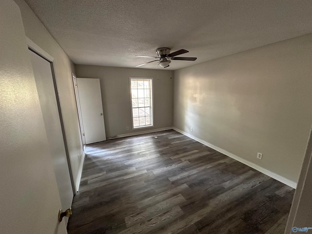 unfurnished room with ceiling fan, hardwood / wood-style flooring, and a textured ceiling