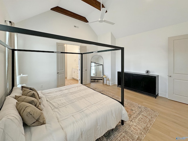 bedroom featuring high vaulted ceiling, connected bathroom, beamed ceiling, light wood-type flooring, and ceiling fan