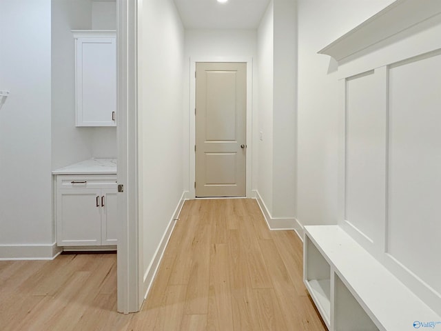 hall with light hardwood / wood-style floors