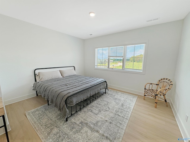 bedroom with light wood-type flooring