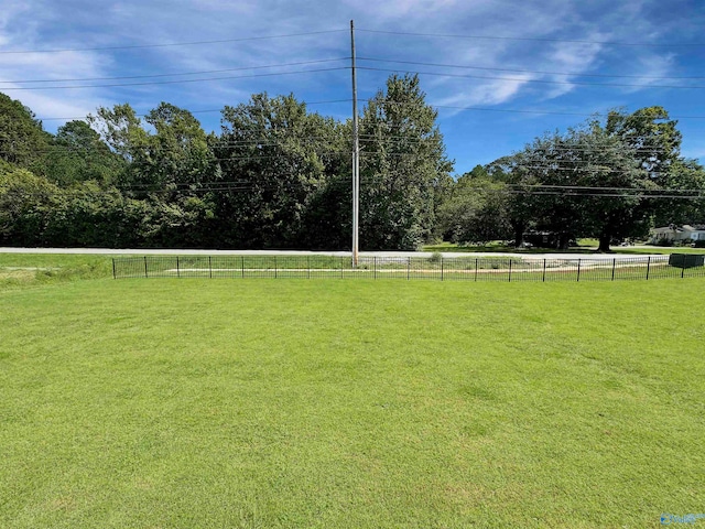 view of yard with a rural view