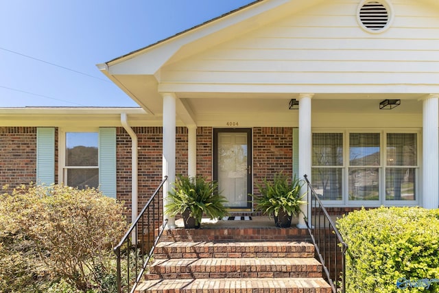 doorway to property with a porch