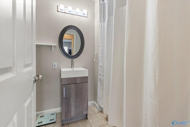 bathroom featuring tile patterned floors and vanity