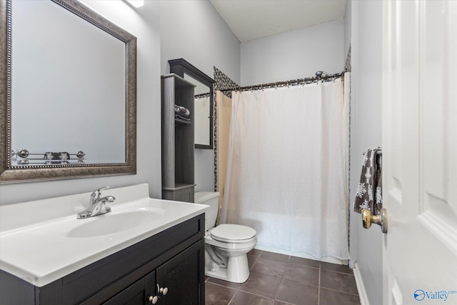 full bathroom featuring tile patterned flooring, vanity, shower / bath combination with curtain, and toilet