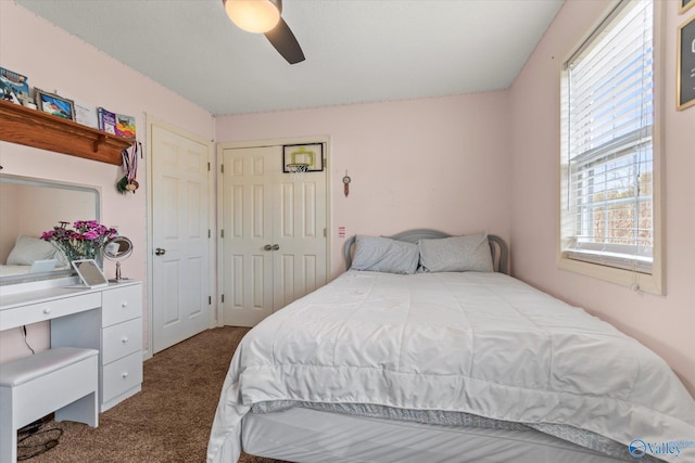 bedroom featuring a closet, ceiling fan, and carpet