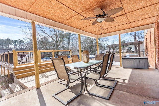 view of patio with ceiling fan and a pergola