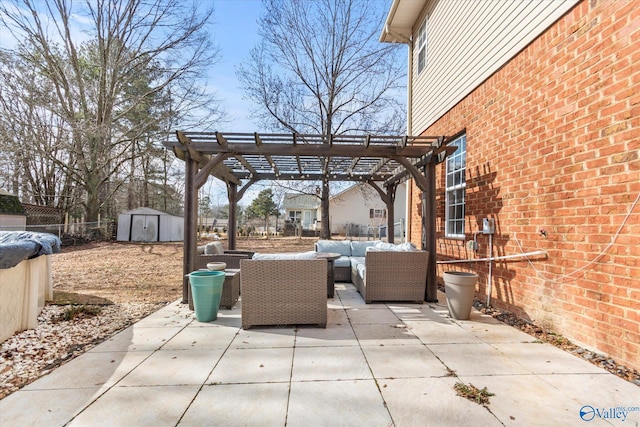 view of patio with a storage shed, outdoor lounge area, and a pergola