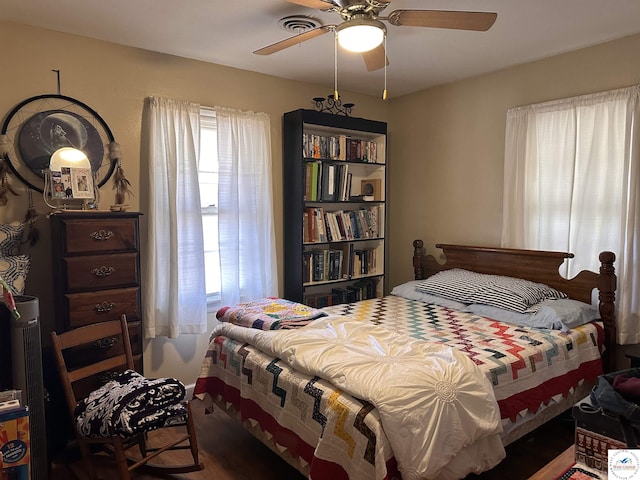 bedroom featuring a ceiling fan and visible vents