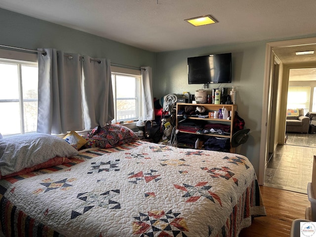 bedroom with wood finished floors