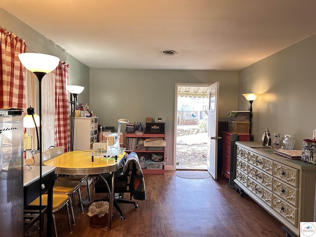 office space featuring wood finished floors and visible vents