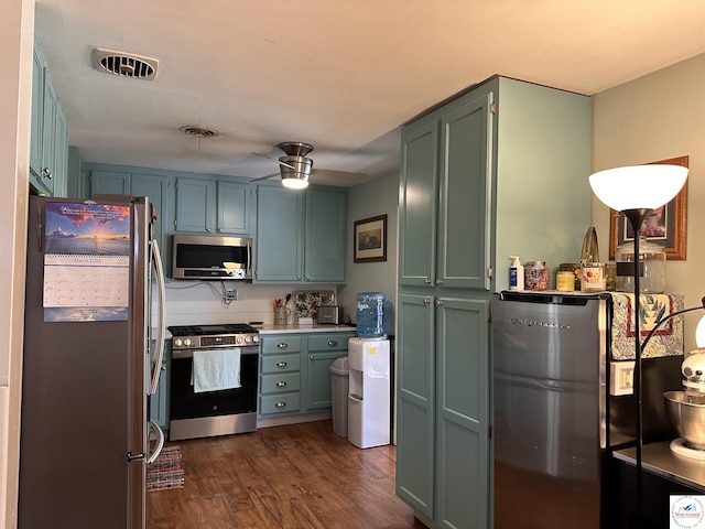 kitchen featuring a ceiling fan, dark wood-style floors, visible vents, and appliances with stainless steel finishes