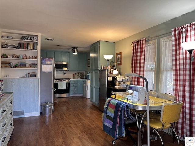 dining space with visible vents, ceiling fan, and dark wood-style flooring