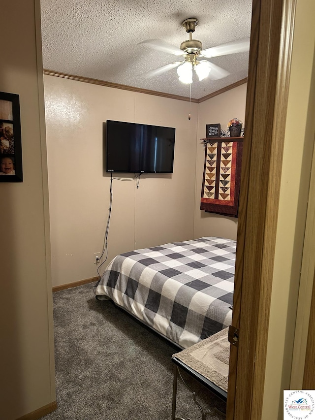 bedroom with ornamental molding, carpet, ceiling fan, and a textured ceiling