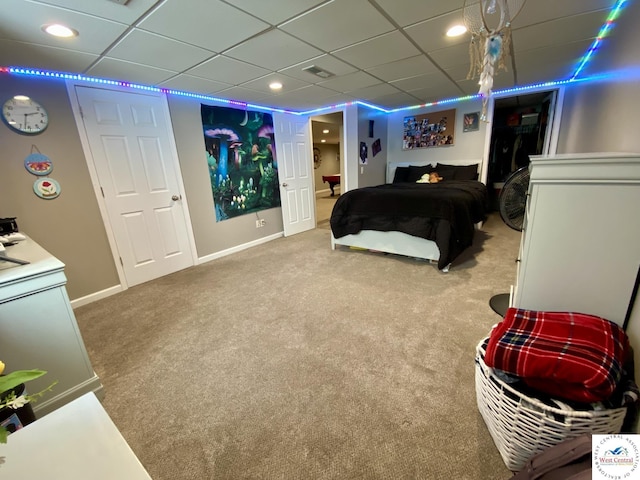 carpeted bedroom with visible vents, baseboards, a drop ceiling, and recessed lighting