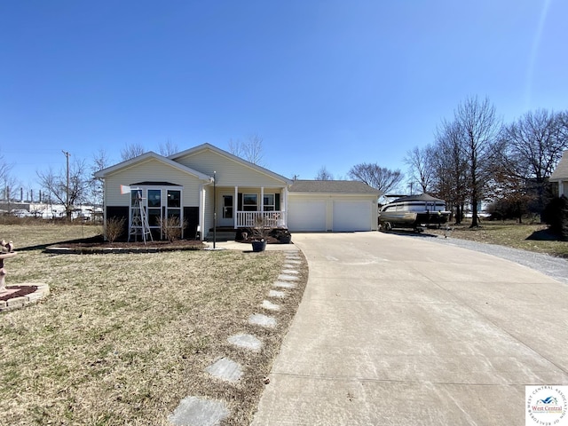 view of front facade with a porch, driveway, and an attached garage