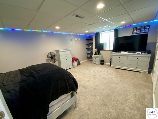 carpeted bedroom with a paneled ceiling, recessed lighting, visible vents, and baseboards