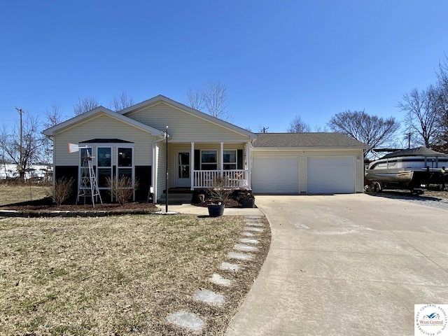 view of front of house with a porch, concrete driveway, and an attached garage