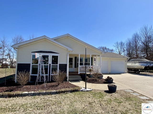 view of front facade with covered porch, concrete driveway, a shingled roof, and a garage