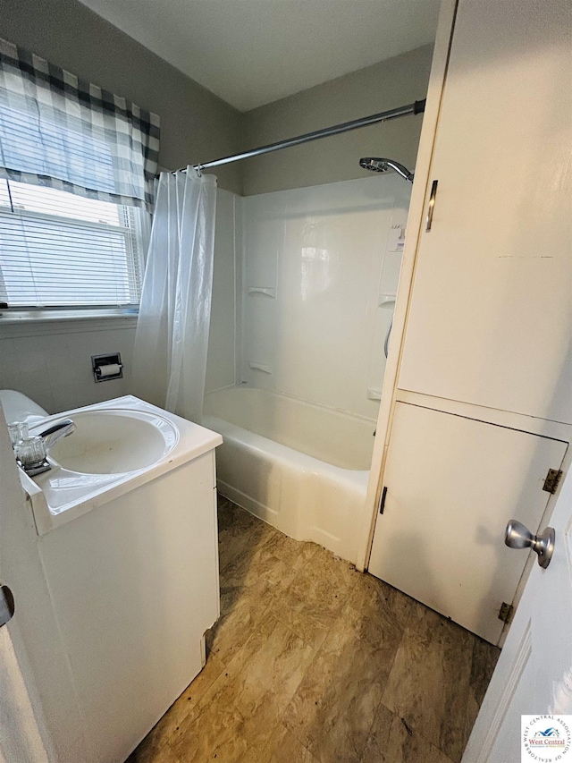 bathroom featuring shower / bath combo and a sink