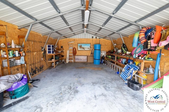 garage featuring metal wall and a workshop area