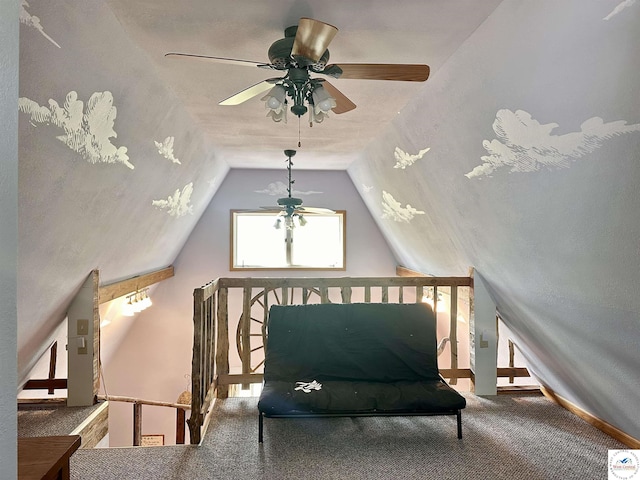 additional living space with a ceiling fan, carpet flooring, and lofted ceiling
