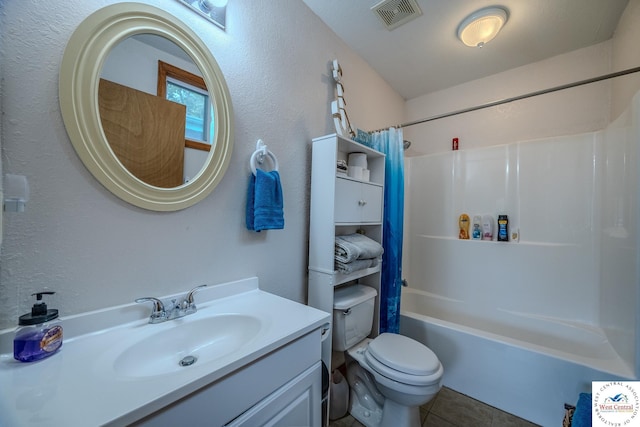 full bath featuring vanity, visible vents, tile patterned flooring, shower / tub combo, and toilet