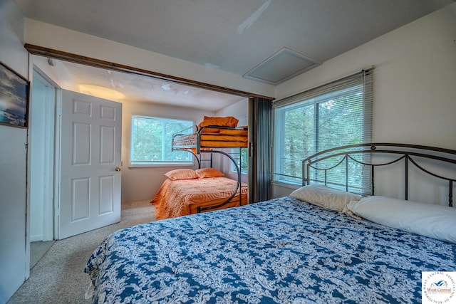 carpeted bedroom with attic access