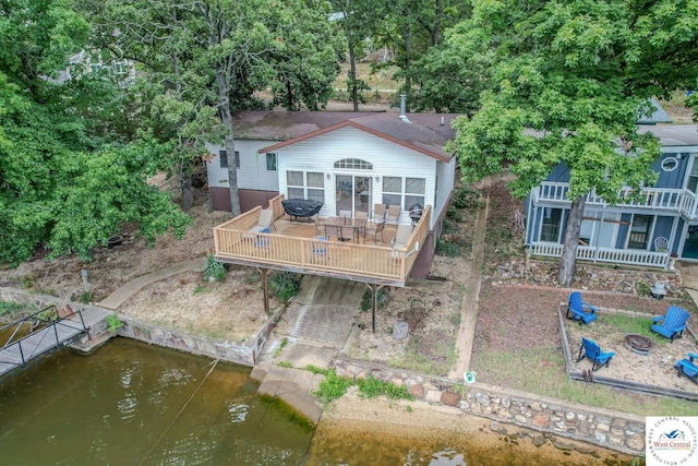 rear view of house with a wooden deck