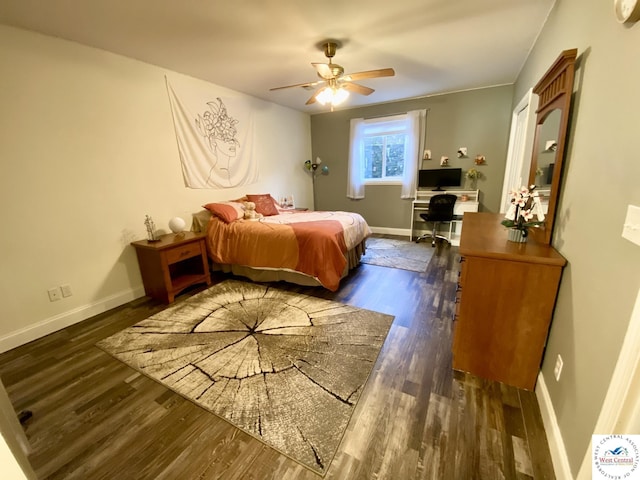 bedroom featuring dark wood-style floors, baseboards, and a ceiling fan