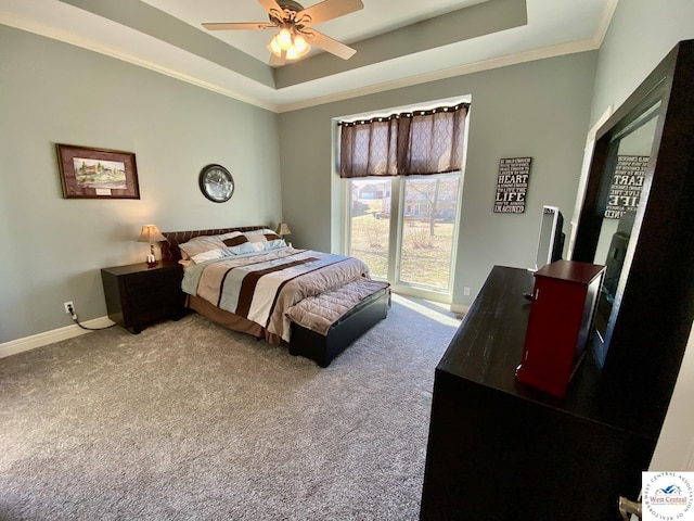 bedroom with carpet, ornamental molding, a raised ceiling, and baseboards