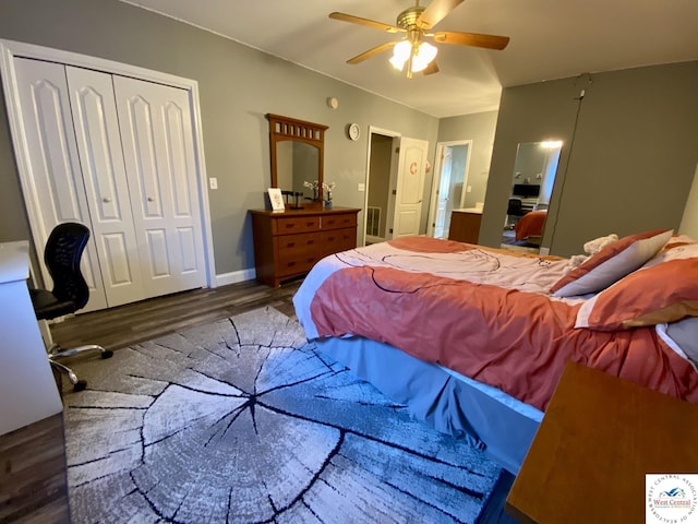 bedroom featuring baseboards, a ceiling fan, ensuite bath, wood finished floors, and a closet