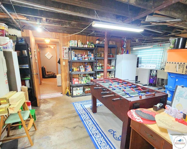 game room with unfinished concrete flooring