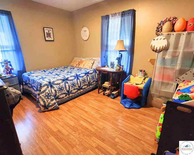 bedroom with wood finished floors