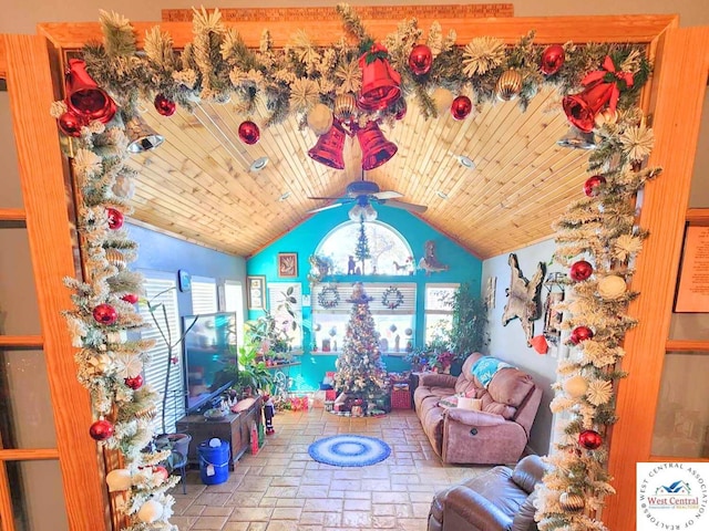 rec room featuring lofted ceiling, stone finish flooring, wooden ceiling, and a ceiling fan