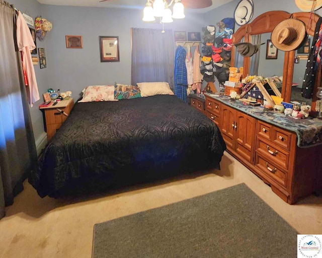 bedroom featuring light carpet and ceiling fan