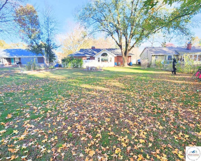 view of yard with a residential view and fence