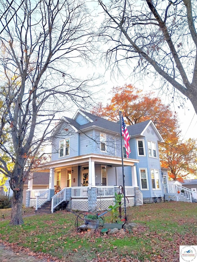 victorian-style house featuring a porch