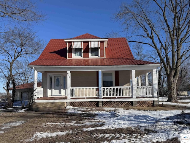 view of front of house with a porch and metal roof