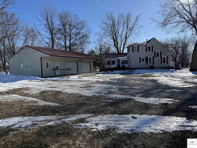 yard covered in snow with driveway