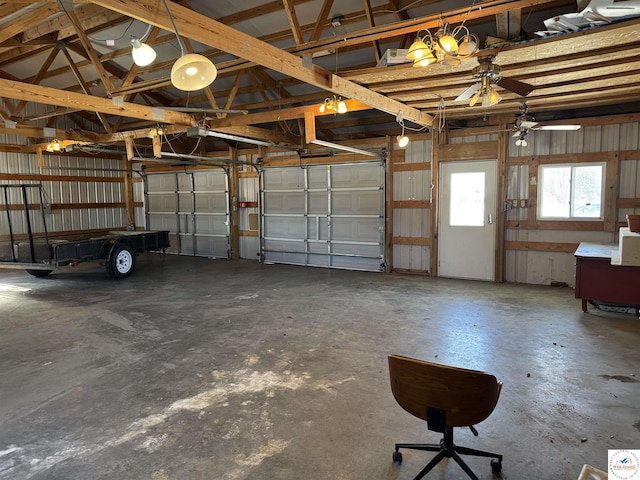 garage with a garage door opener and metal wall