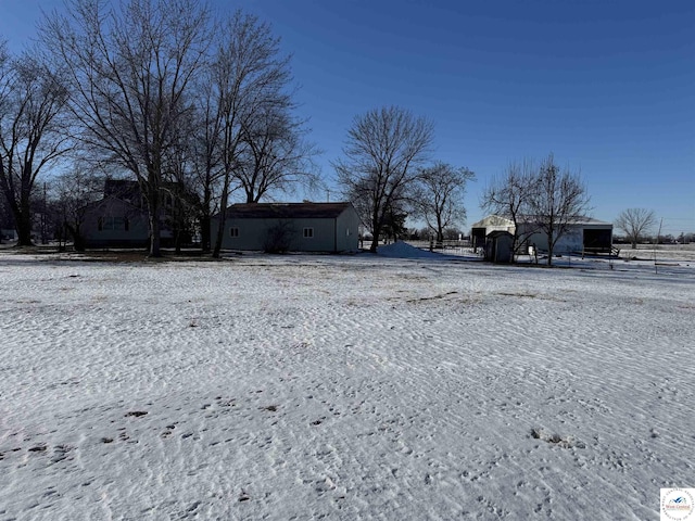 view of yard layered in snow